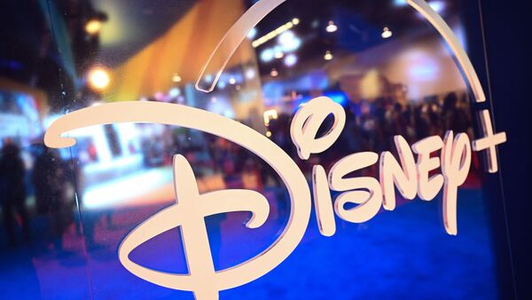 (FILES) Fans are reflected in Disney+ logo during the Walt Disney D23 Expo in Anaheim, California on September 9, 2022. Disney canceled plans for a new employee campus in central Florida on may 18, 2023 in the latest ripple effect from its feud with Republican governor of the state Ron DeSantis.