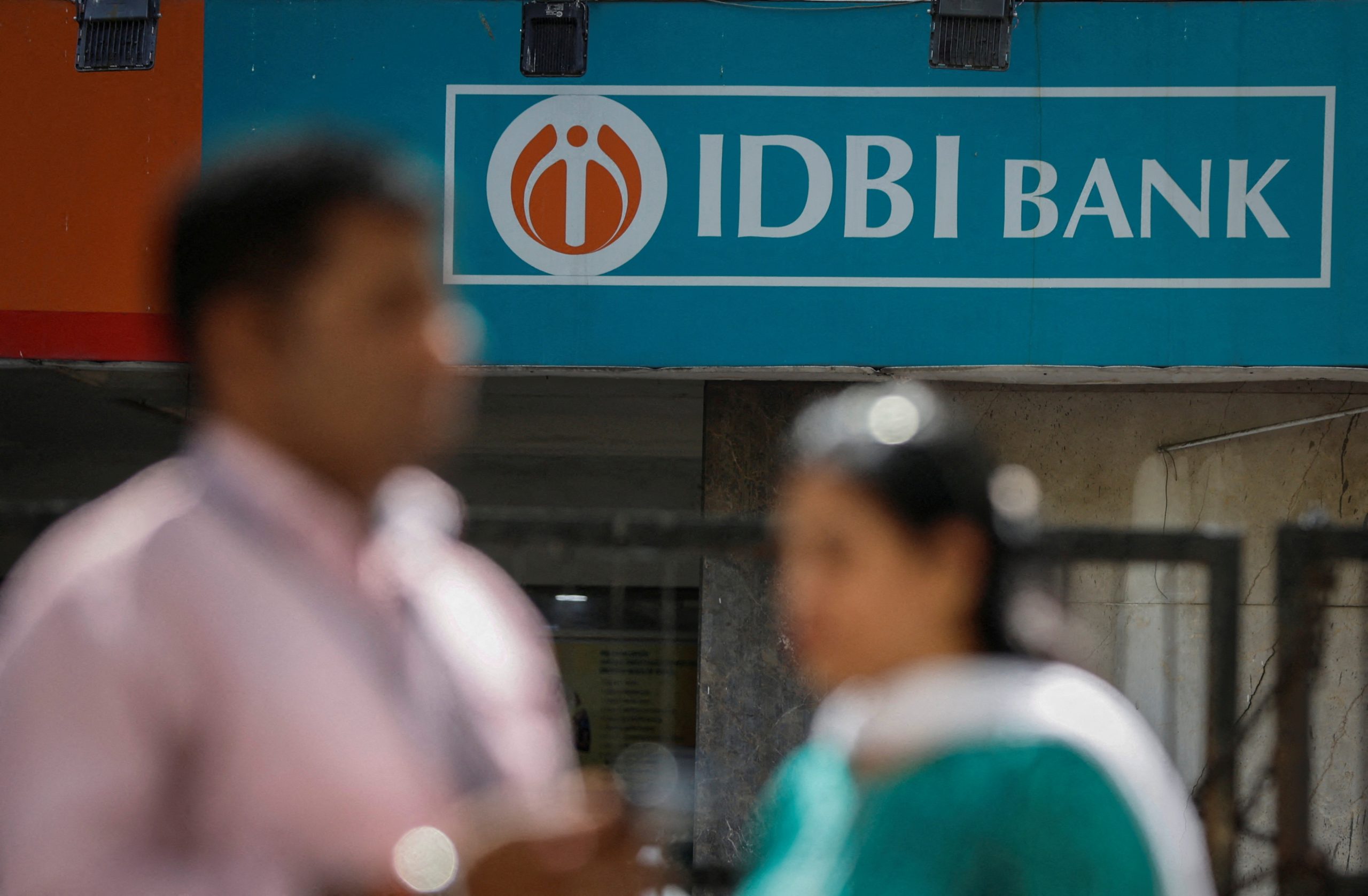 People walk past a branch of IDBI Bank in New Delhi (Image/Reuters)